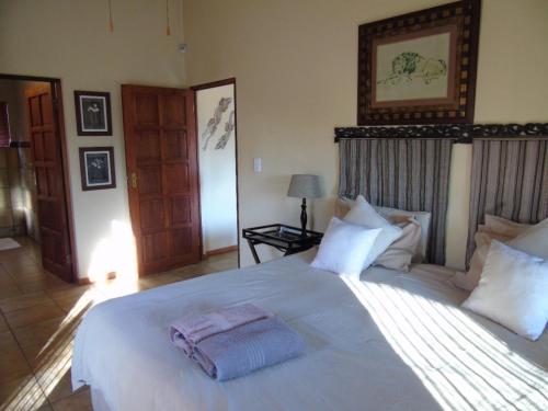 Voodi või voodid majutusasutuse Da Gama Lake Cottages - Coral Tree toas