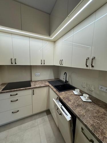 Kuchyň nebo kuchyňský kout v ubytování Apartament Zębcowska