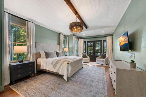 a bedroom with a bed and a tv in it at Lakeview Landing in Morganton