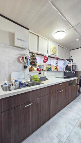 a kitchen with a christmas tree on the counter at YAHouse in Chiba