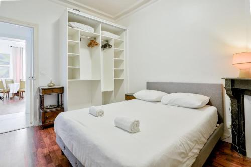 Ένα ή περισσότερα κρεβάτια σε δωμάτιο στο Apt unique pour 4 à Rosny-Sous-Bois à 30m de Paris