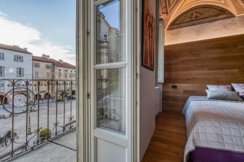 Postel nebo postele na pokoji v ubytování Grigio Perla Mondovi