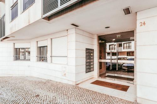 a facade of a building with a glass door at Modern & Elegant 2 bedroom in Amadora by GT House in Amadora