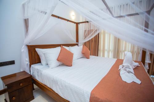 Ένα ή περισσότερα κρεβάτια σε δωμάτιο στο Villa Sun Haven