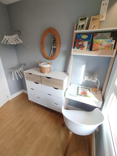 a bathroom with a white dresser and a mirror at OFERTA ESPECIAL ÚLTIMA HORA - SARAKATUA15 - vistas espectaculares - familias y parejas - 2 dormitorios independientes - amplio salón cocina comedor - tarjeta parking OTA GRATIS - Julio y agosto estancia mínima 7 noches de domingo a domingo - in Zarautz