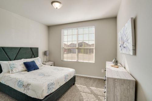 a bedroom with a bed and a window at Work, Explore and Unwind Lovely Permian Basin Home in Odessa