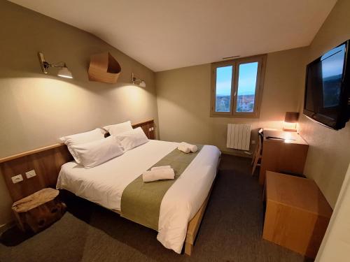 Ένα ή περισσότερα κρεβάτια σε δωμάτιο στο Résidence L'Atelier