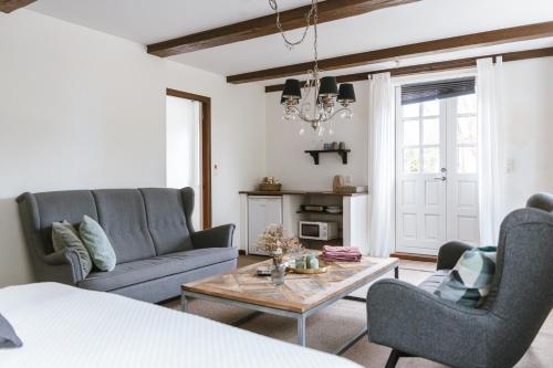 a living room with a couch and a coffee table at Lindegaarden Kollund in Kruså