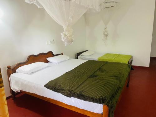 Ένα ή περισσότερα κρεβάτια σε δωμάτιο στο Bloom Guest House