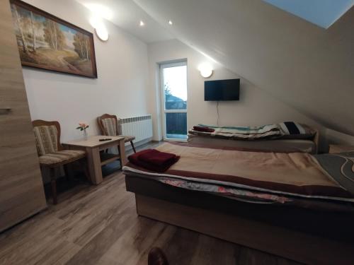 Μια τηλεόραση ή/και κέντρο ψυχαγωγίας στο Wiosenny Biały Domek u Małgosi