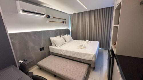 Ένα ή περισσότερα κρεβάτια σε δωμάτιο στο Flat Alta Garden pé na areia, Praia do Bessa