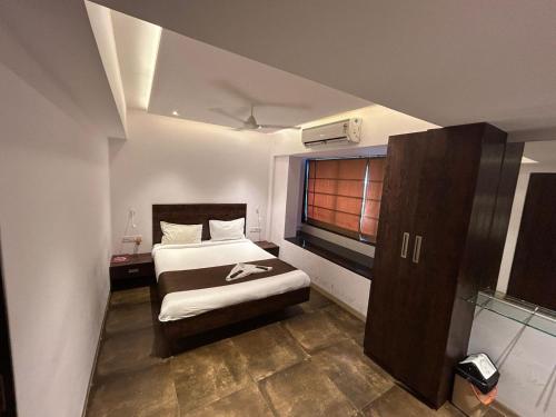 Ένα ή περισσότερα κρεβάτια σε δωμάτιο στο Lucky Service Apartments - Near BKC