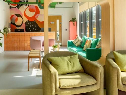 a living room with two chairs and a couch at For Students Only The Brook in Bath in Bath