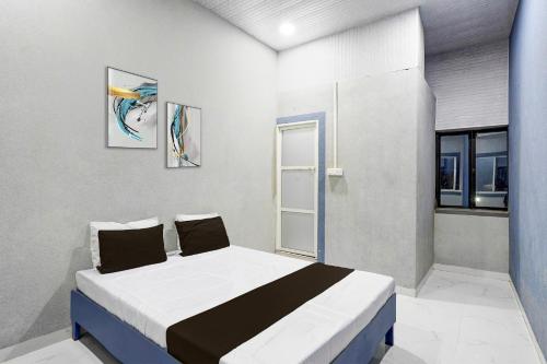 Ένα ή περισσότερα κρεβάτια σε δωμάτιο στο Hotel O The Lotas Gardan