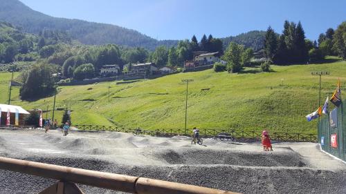 a group of people riding bikes on a dirt road at Santa Elisabetta Apartment in Caspoggio