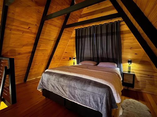 Voodi või voodid majutusasutuse Cabana Chale com Adega 2km do Centro toas