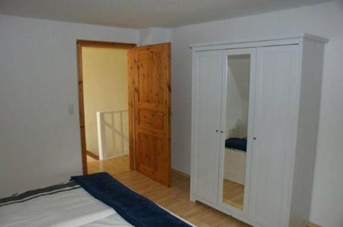 Ένα ή περισσότερα κρεβάτια σε δωμάτιο στο Ferienwohnung Schoenk In Havetoft