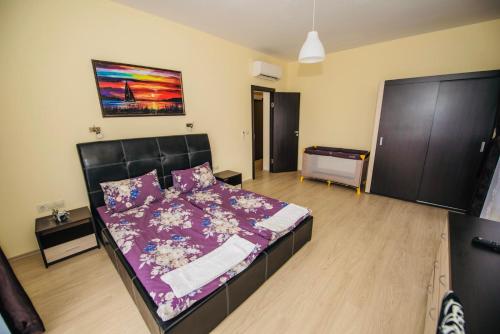 Postel nebo postele na pokoji v ubytování Vakarel Residence