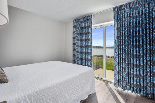 Voodi või voodid majutusasutuse Top Floor Standard Suite Bay View TBSSBV toas