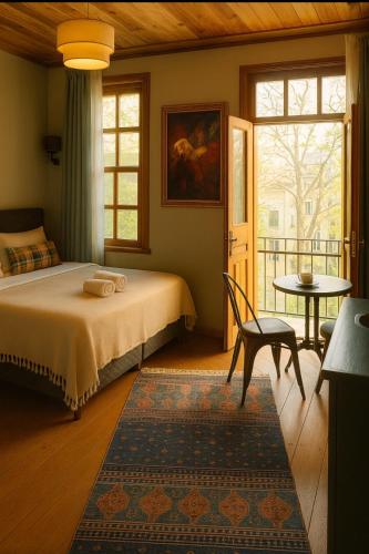 a bedroom with a bed and a chair and a window at NarPera Taksim in Istanbul