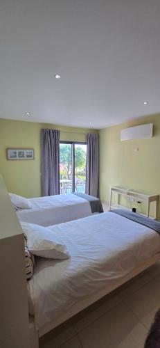 Ένα ή περισσότερα κρεβάτια σε δωμάτιο στο Casa da Praia