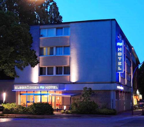 a building with a sign on the front of it at Elbbrücken Hotel in Hamburg