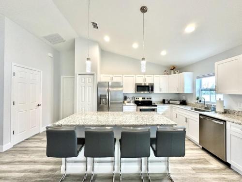 a large kitchen with a large table and chairs at White Oak Spacious and Comfy in Marion Oaks