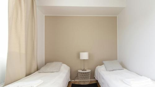 Ένα ή περισσότερα κρεβάτια σε δωμάτιο στο Central Apartment for 3