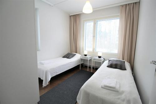 Ένα ή περισσότερα κρεβάτια σε δωμάτιο στο Convenient Apartment for 5 with Sauna