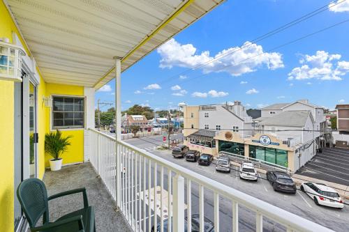 a balcony with a view of a street at SURFRIDER Dewey Beach Ocean Block in Dewey Beach