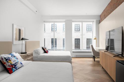 TV a/nebo společenská místnost v ubytování Nomade Saint Paul