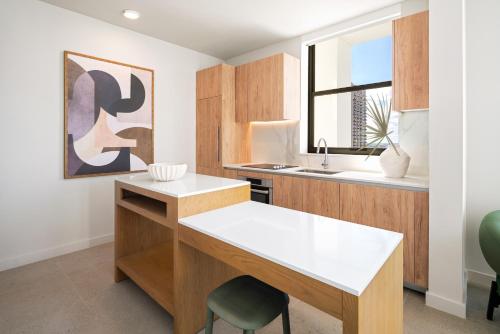 a kitchen with a desk and a sink at The Crosby Miami Worldcenter in Miami