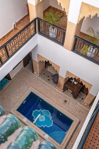 an overhead view of a house with a swimming pool at Riad Serendip in Marrakesh