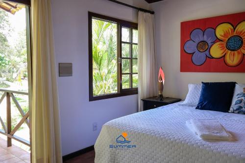 Ένα ή περισσότερα κρεβάτια σε δωμάτιο στο Apartamento Girassóis com 2 suites- Summer Hospedagem