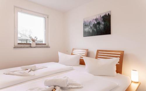 Postel nebo postele na pokoji v ubytování Ostseebad-Zinnowitz-Kernsanierte-Ferienwohnung-Glueck