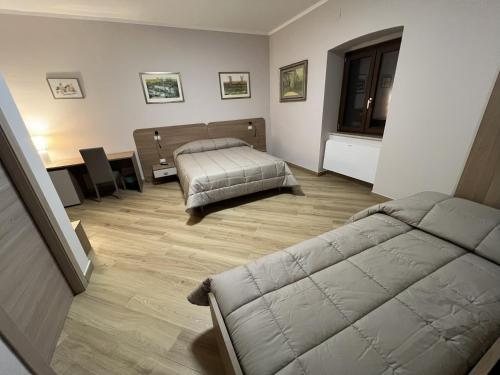 Ένα ή περισσότερα κρεβάτια σε δωμάτιο στο Agriturismo L'Ape Regina