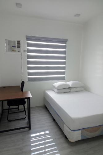 Ένα ή περισσότερα κρεβάτια σε δωμάτιο στο Room in Pinan ZDN
