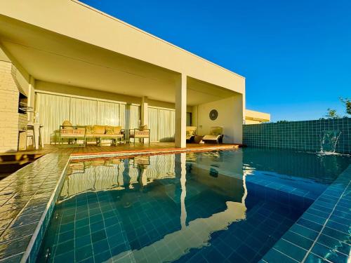 Bazén v ubytování Pousada Hari - ar condicionado e piscina nebo v jeho okolí