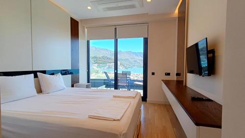 Ένα ή περισσότερα κρεβάτια σε δωμάτιο στο Bellemond Hotel & Residences