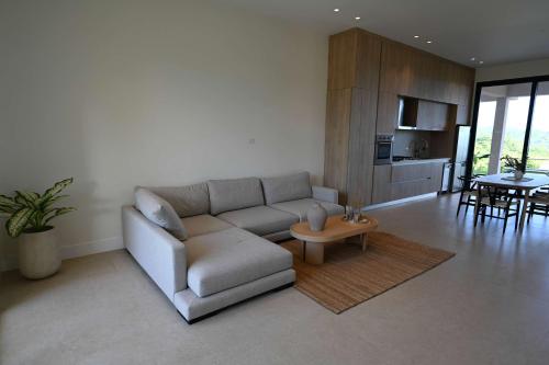 a living room with a couch and a table at Oceanview Home with Pool in Venao in Playa Venao
