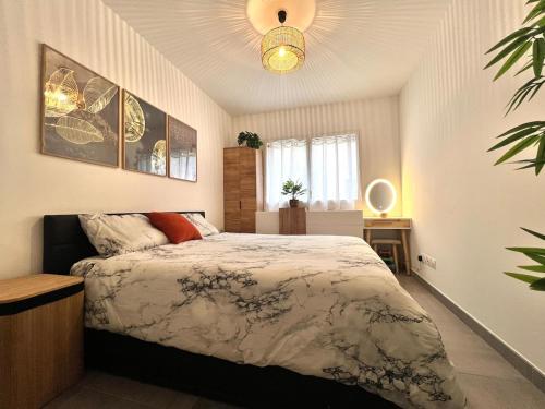 a bedroom with a king sized bed in a room at Modern Luxury - Sea View over Èze Village in Èze