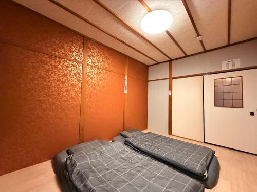 Postel nebo postele na pokoji v ubytování Hirakata - House - Vacation STAY 20199