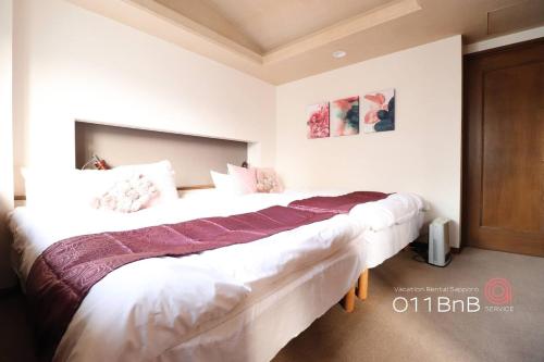 Voodi või voodid majutusasutuse NK Building 7th and 8th floors - Vacation STAY 66227v toas