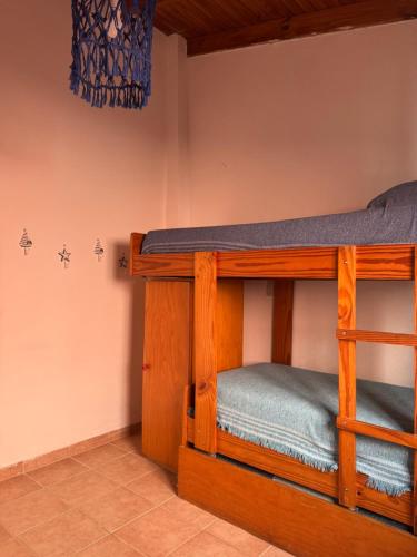 a bedroom with bunk beds in a room at Las Grutas Star in Las Grutas