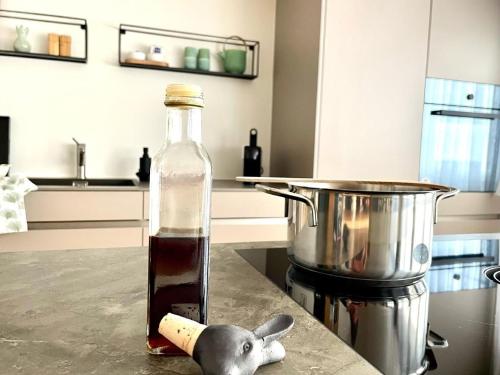 a bottle of sauce sitting on a counter in a kitchen at Ferienwohnung Im Dorf Urnäsch in Urnäsch