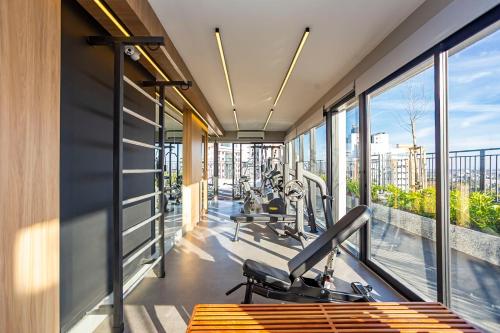 a gym with treadmills and cardio equipment in a building at My Place in Curitiba