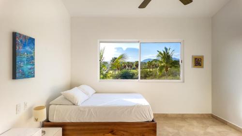 Ένα ή περισσότερα κρεβάτια σε δωμάτιο στο Spectacular 2 BR Oceanview Penthouse