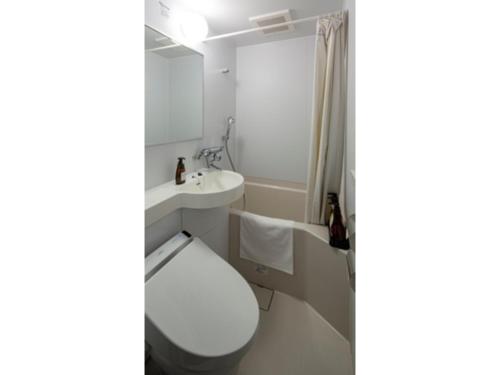 a bathroom with a toilet and a sink at Hotel Reference Tenjin - Vacation STAY 80083v in Susakiuramachi