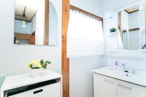 a bathroom with a sink and a mirror at Awaji Centaral Villa in Shizuki - Vacation STAY 81902v in Shizuki