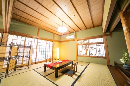 a room with a table in the middle of a room at Awaji Centaral Villa in Shizuki - Vacation STAY 81902v in Shizuki